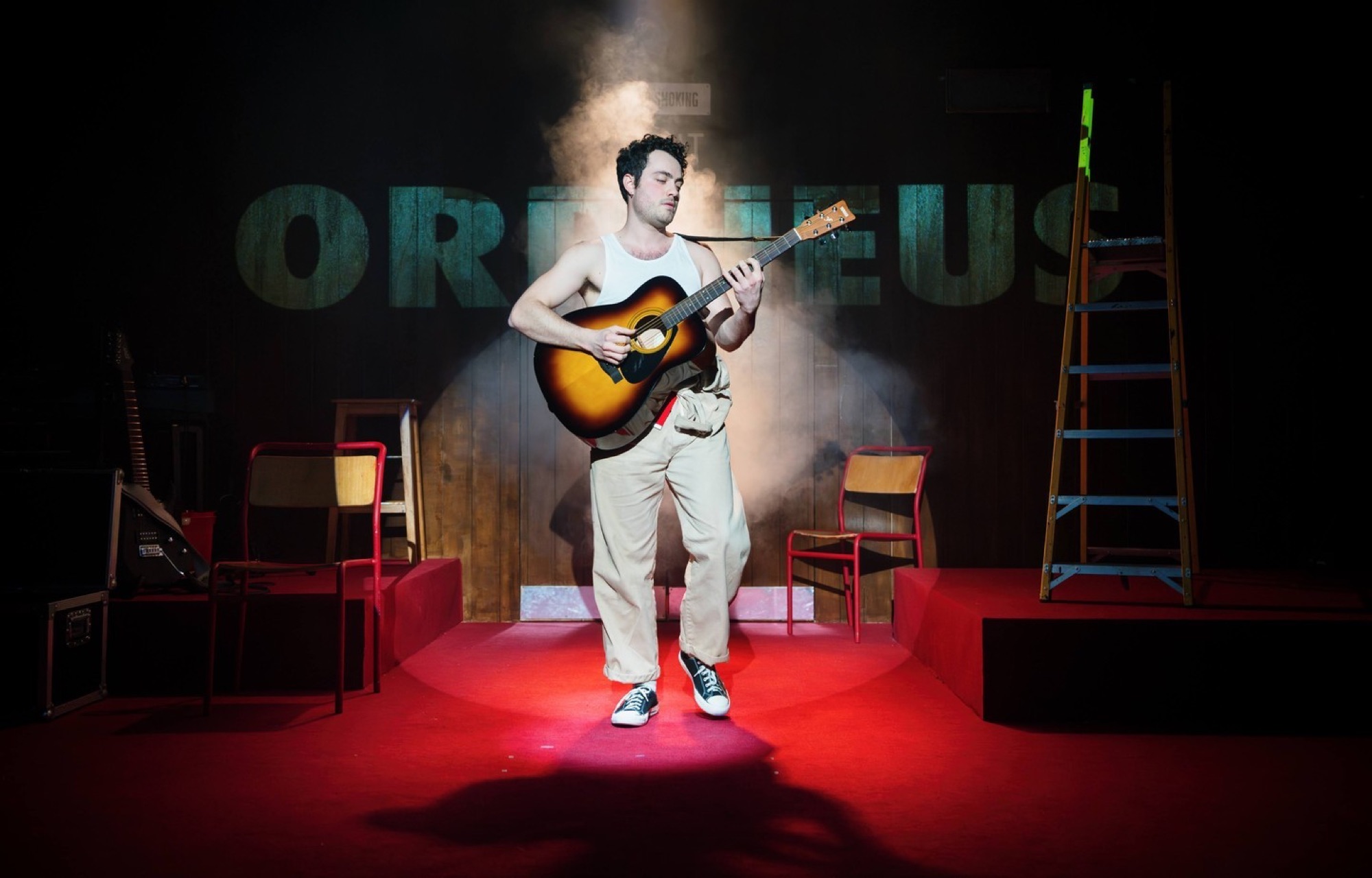 Metamorphoses — Orpheus with a guitar in a shaft of light
